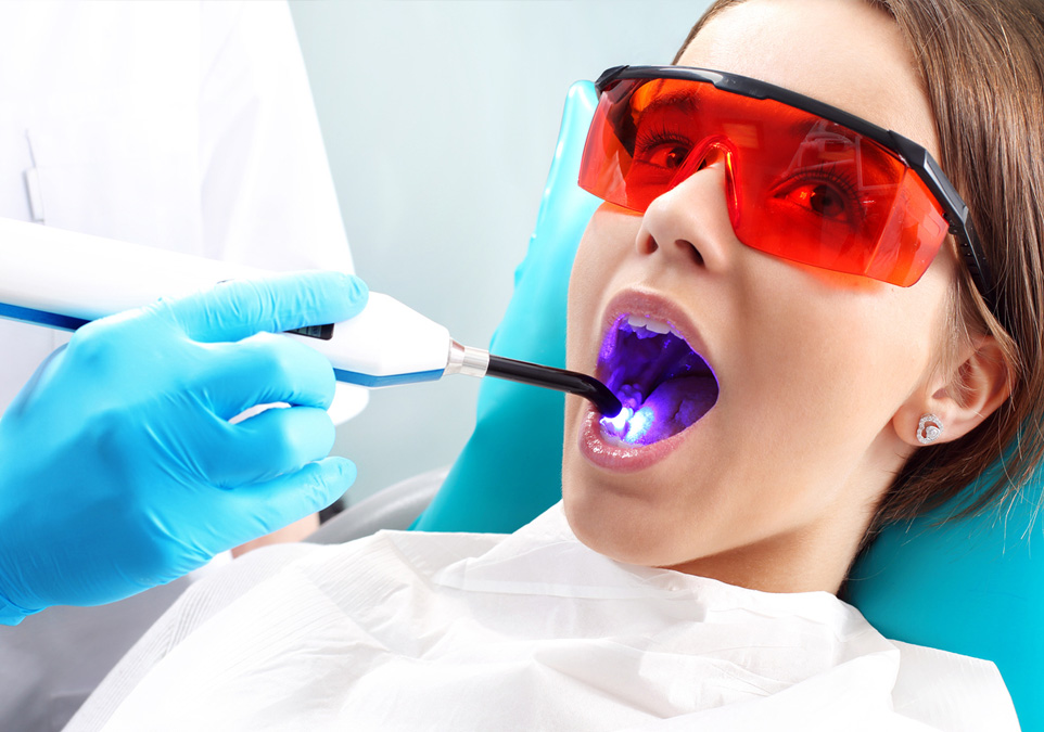 Stock image of a female patient being treated by dentist