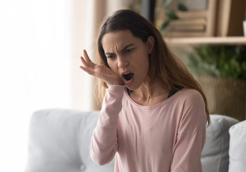 Stock image of an woman feeling tooth pain