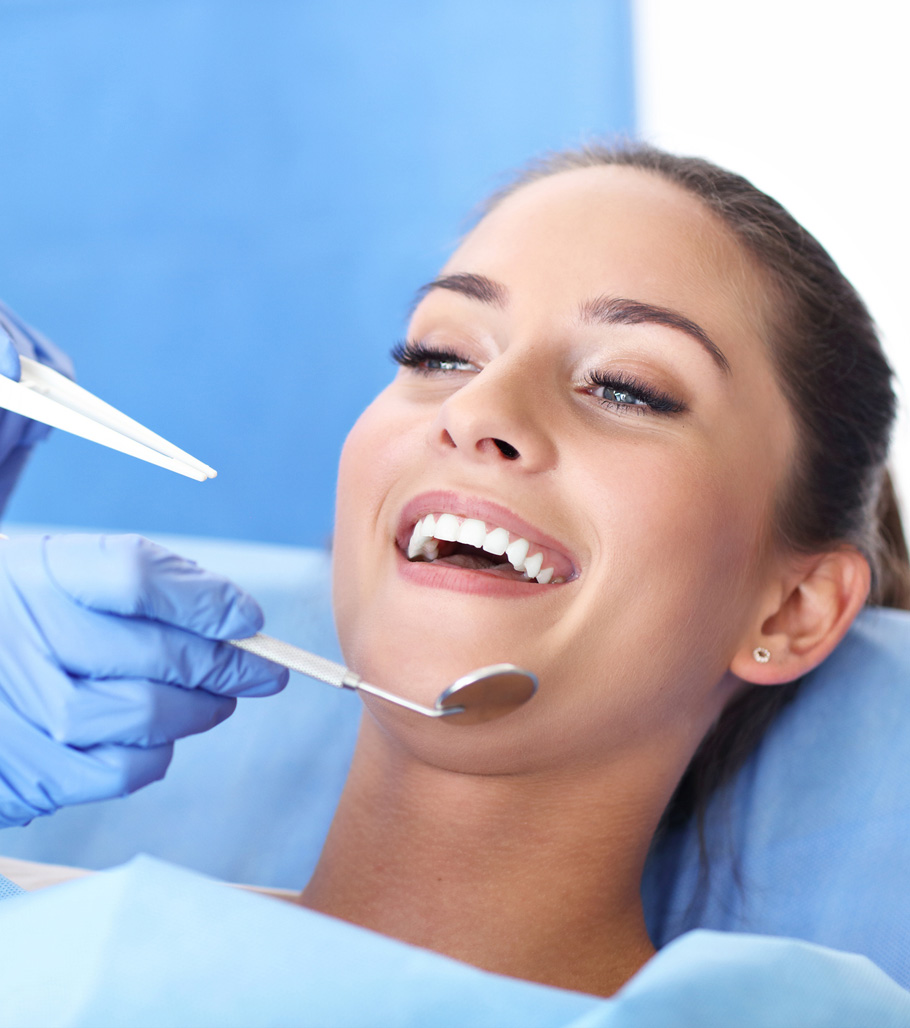 Stock image of a female patient being treated by dentist